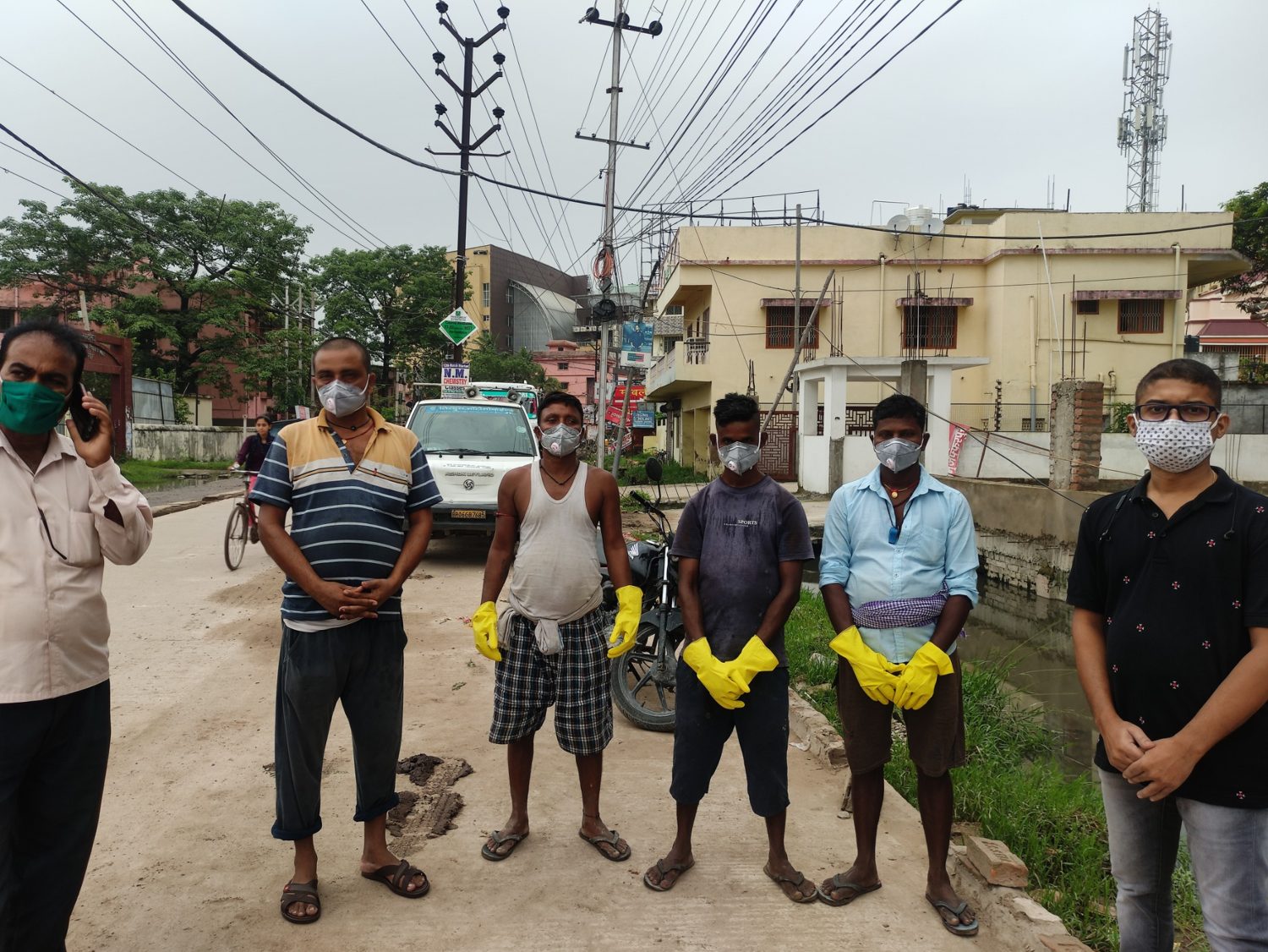 Community members engaged in sanitation and waste-related field work